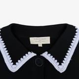 Jersey negro botones y detalles bordado blanco Sézane S