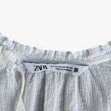 Blusa blanca con hilos plateados y textura a rayas ZARA XS
