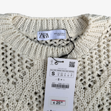 Poncho de punto calado con flecos ZARA S