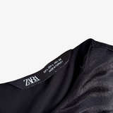Mono corto negro con cinturón de hebilla ZARA L