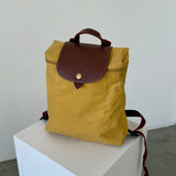 Mochila amarilla Le Pliage Longchamp