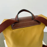 Mochila amarilla Le Pliage Longchamp