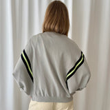 Chaqueta de Punto Gris con Cremallera y Raya Neón Skatïe Brand
