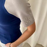 Top neopreno color block azul marino y gris Nina Ricci
